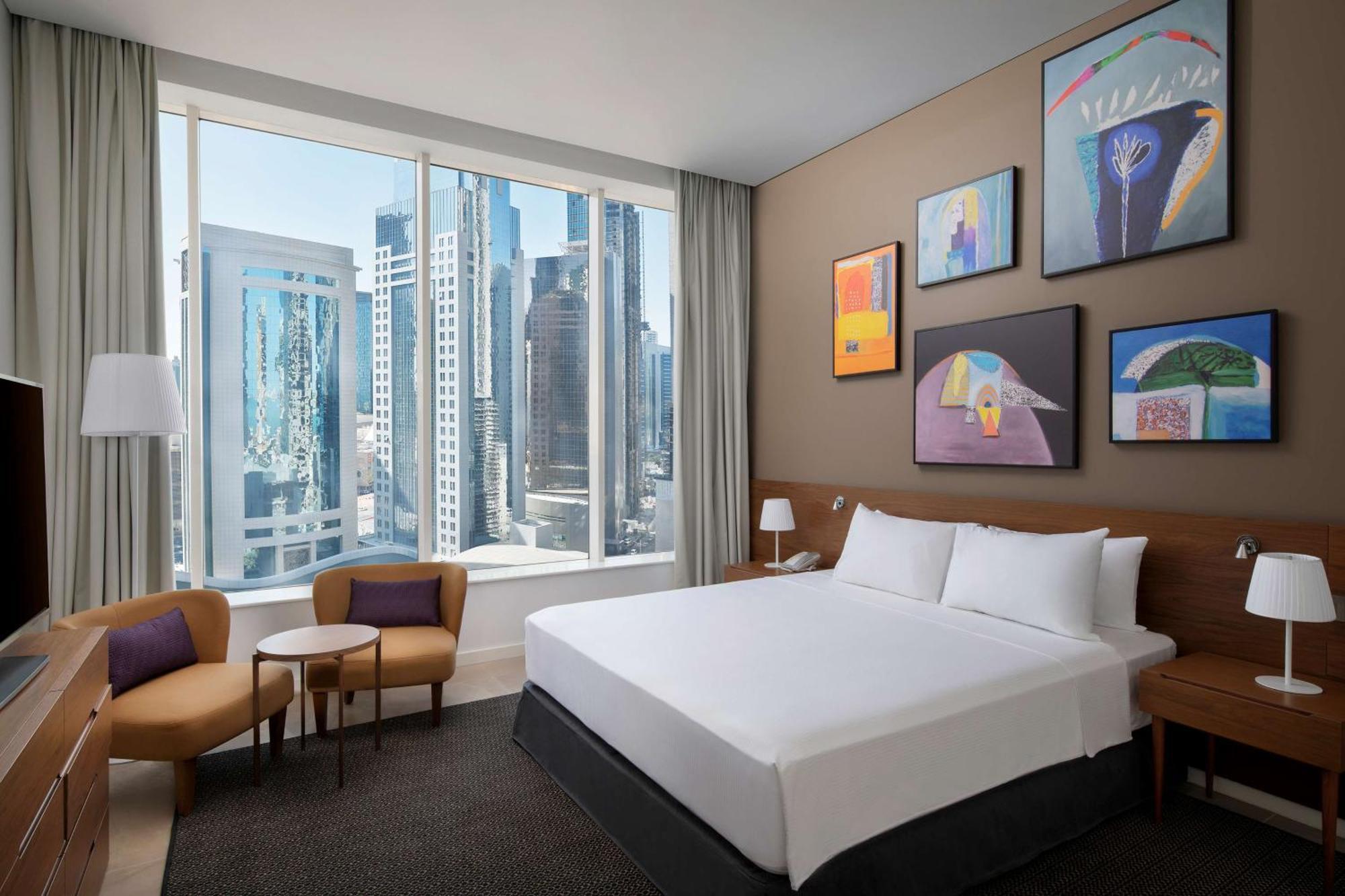 Aleph Doha Residences, Curio Collection By Hilton Luaran gambar A guest room at the hotel