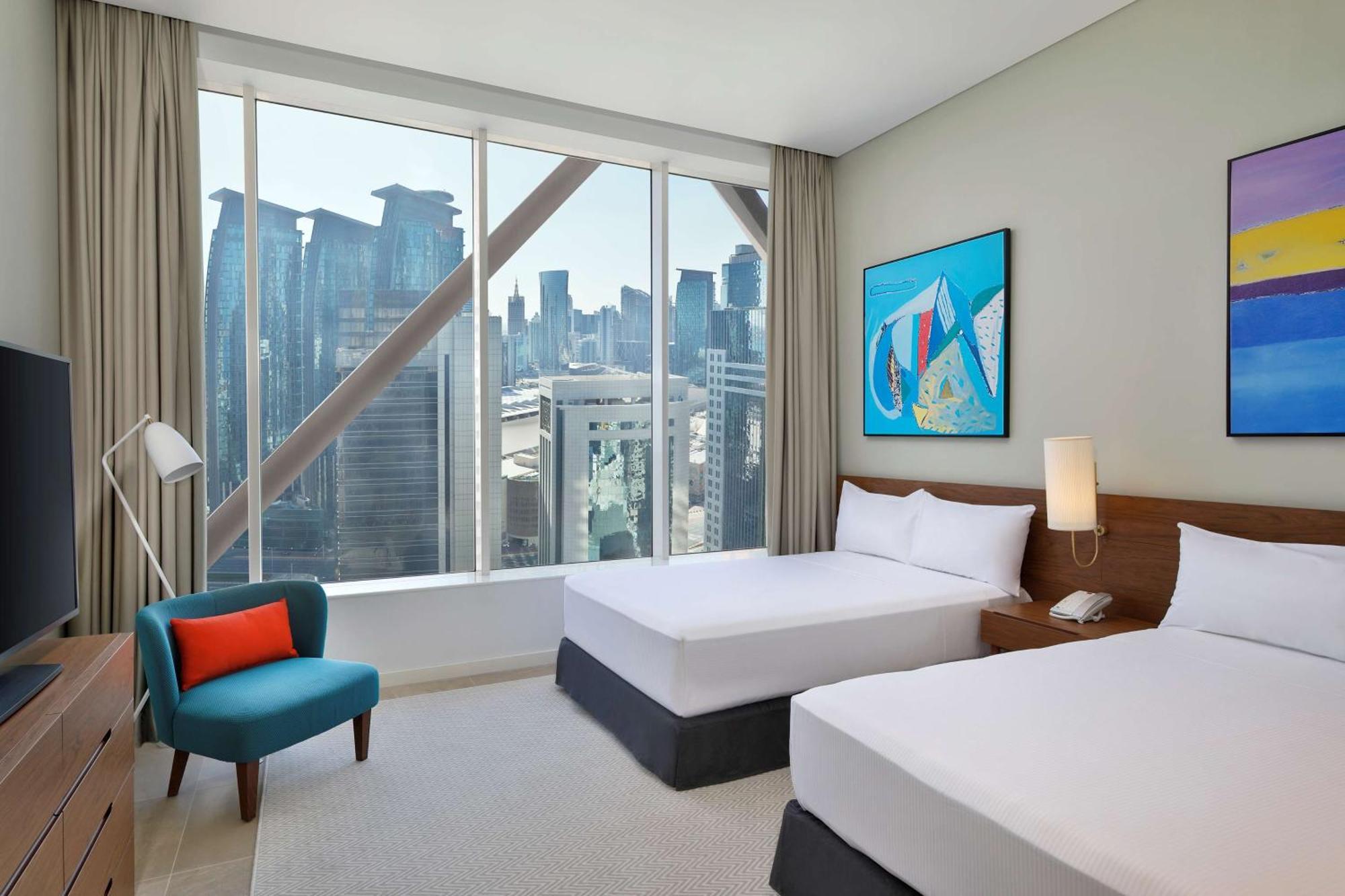 Aleph Doha Residences, Curio Collection By Hilton Luaran gambar A guest room at the hotel