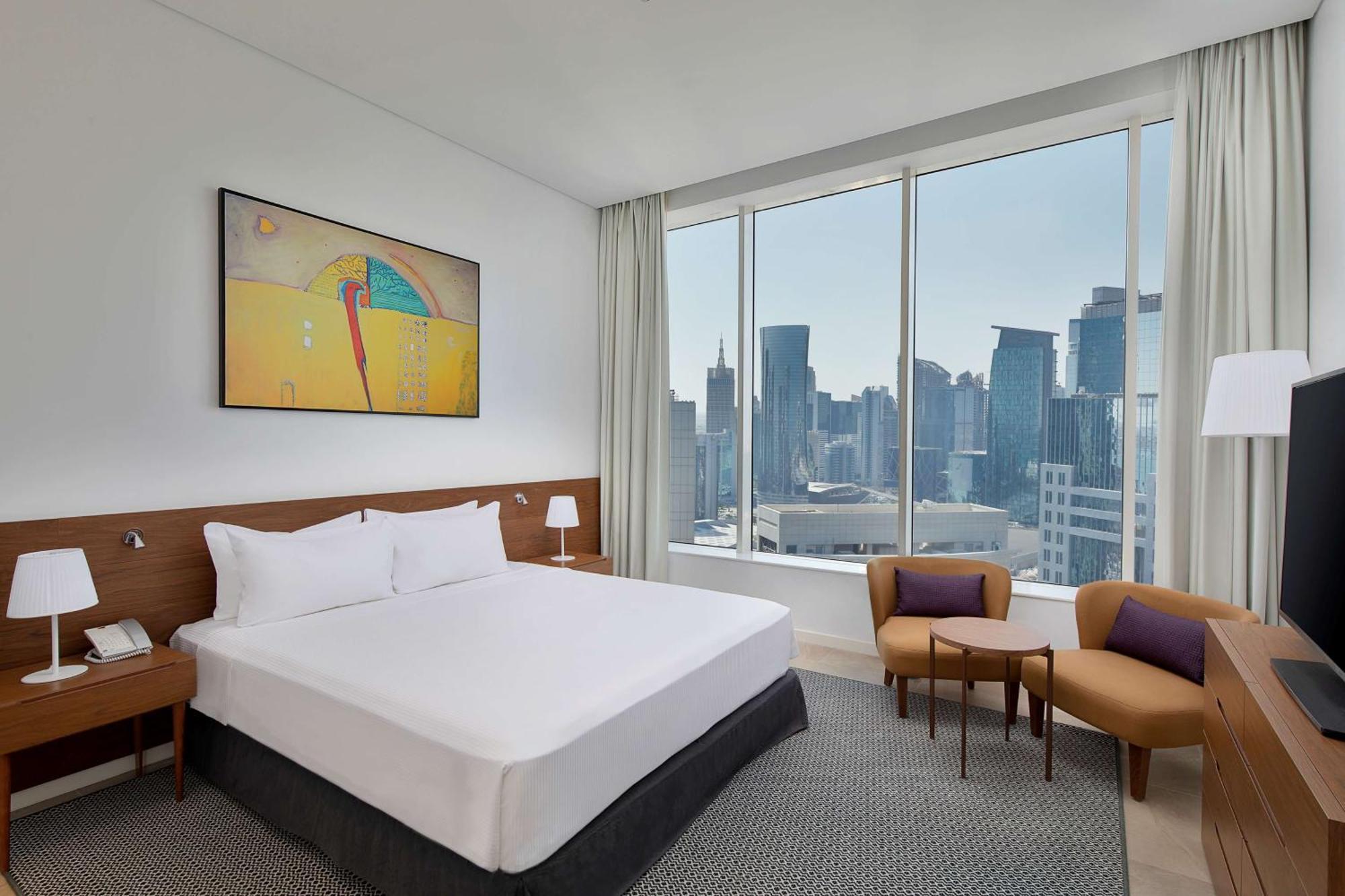 Aleph Doha Residences, Curio Collection By Hilton Luaran gambar A bedroom at the hotel