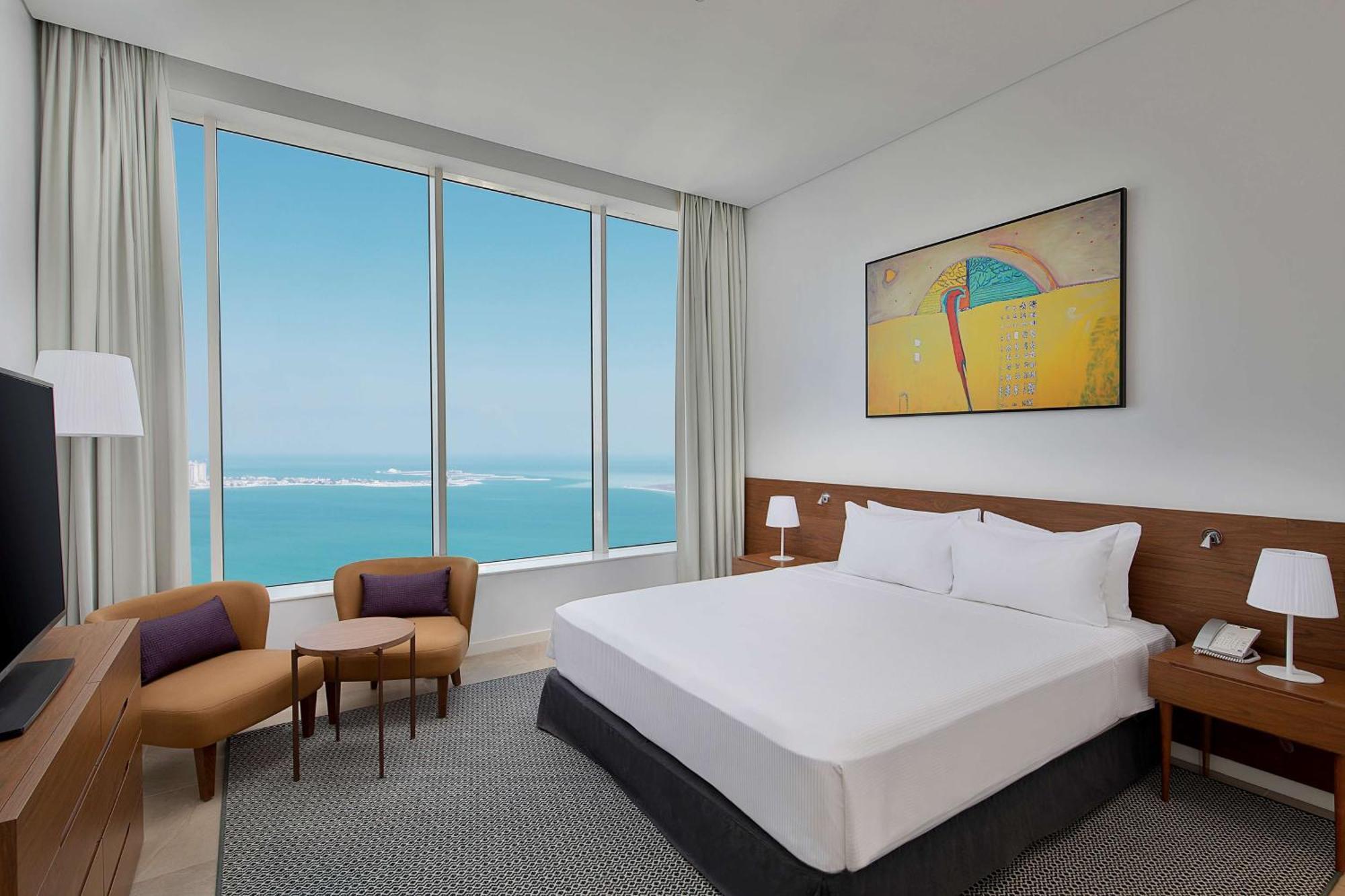 Aleph Doha Residences, Curio Collection By Hilton Luaran gambar A bedroom at the hotel